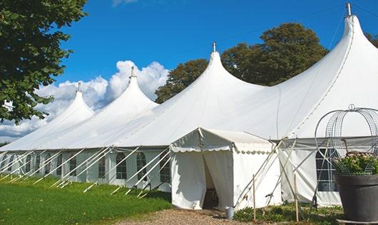 a line of sleek and modern portable restrooms ready for use at an upscale corporate event in Medford